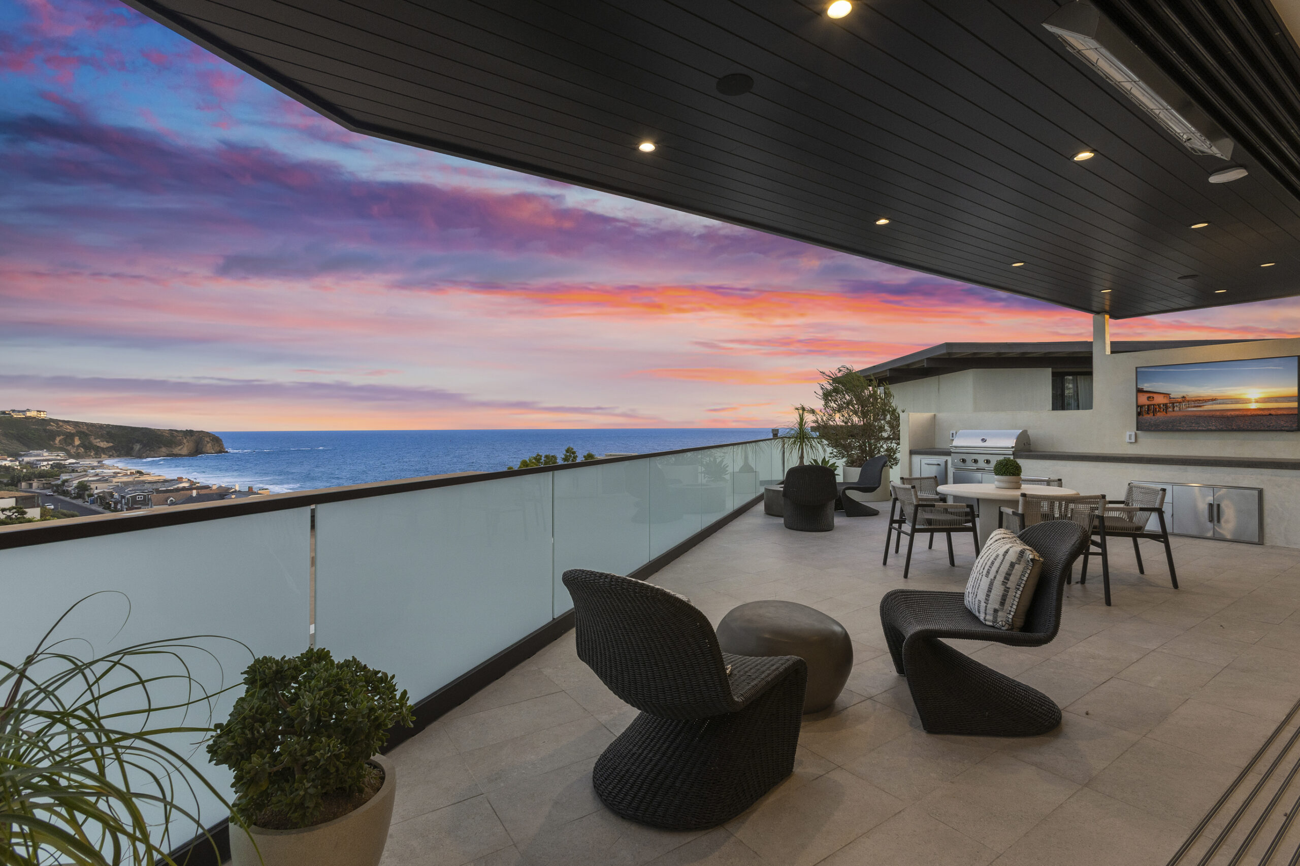 Indoor and outdoor living converge on the expansive ocean-view deck, complete with a built in BBQ ideal for entertaining against a backdrop of coastal sunsets.